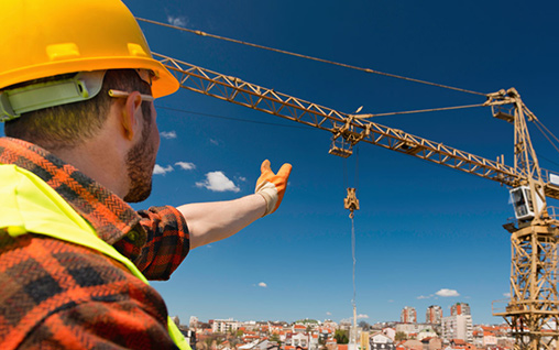 Man Directing a Crane During Rigger Signalman Training