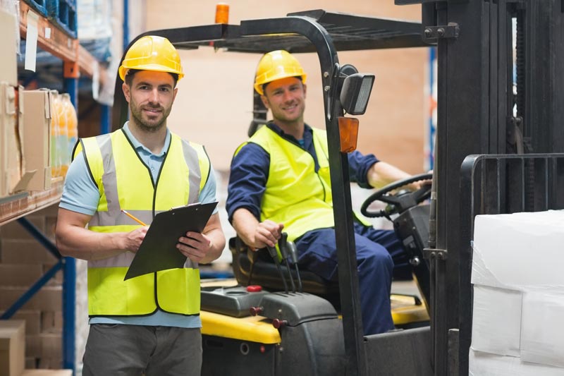 Forklift certification training completed as worker begins operating a fork truck
